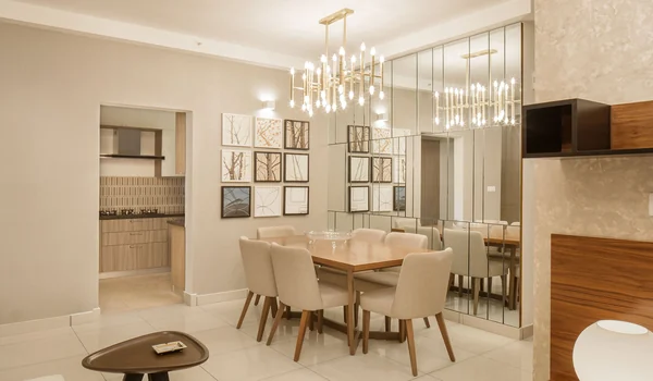 Gallery dining area next to the living space of an apartment