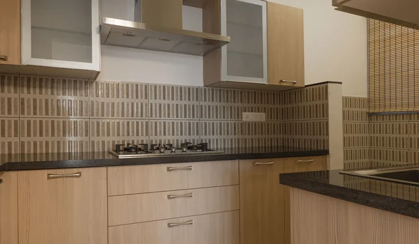 Gallery kitchen interior with granite counters